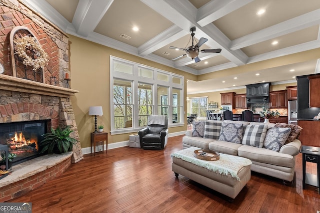 176 Stamp Mill Ln, Dahlonega, GA 30533 - living area with visible vents, a ceiling fan, wood finished floors, and a fireplace