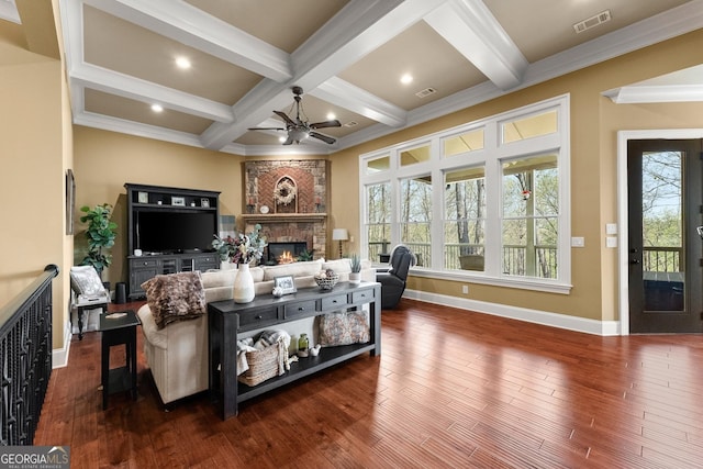 176 Stamp Mill Ln, Dahlonega, GA 30533 - living area featuring beamed ceiling, ceiling fan, wood finished floors, and a fireplace