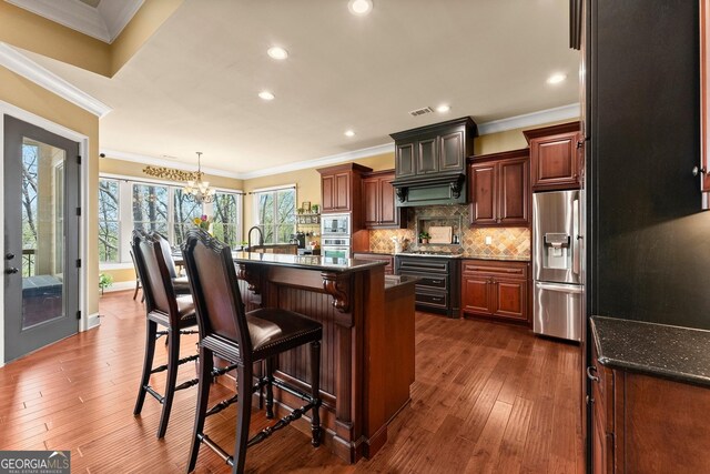 176 Stamp Mill Ln, Dahlonega, GA 30533 - kitchen with appliances with stainless steel finishes, an inviting chandelier, and ornamental molding