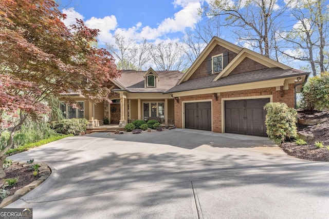 176 Stamp Mill Ln, Dahlonega, GA 30533 - view of front of house with brick siding, an attached garage, a shingled roof, and concrete driveway