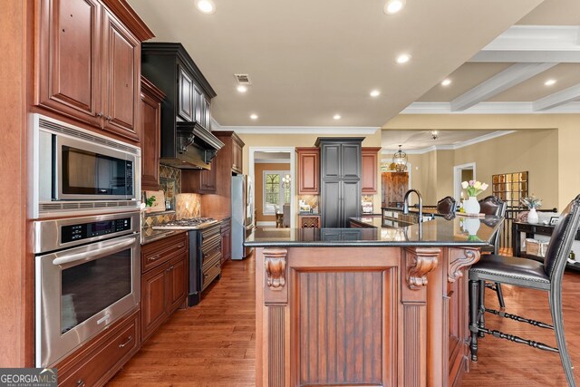 176 Stamp Mill Ln, Dahlonega, GA 30533 - kitchen featuring stainless steel appliances, light wood finished floors, crown molding, and dark countertops