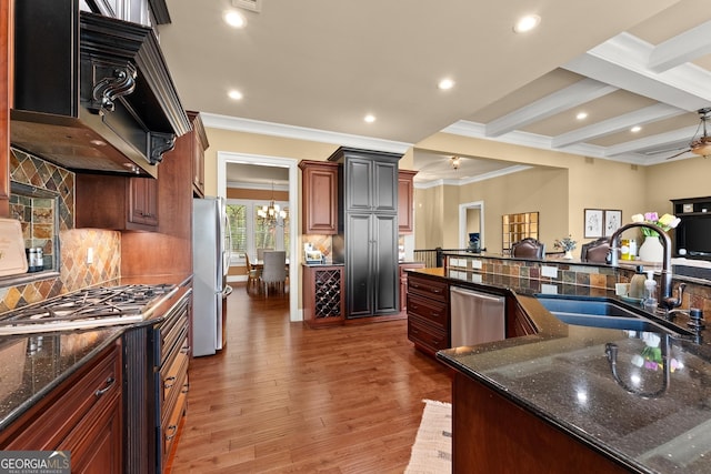 176 Stamp Mill Ln, Dahlonega, GA 30533 - kitchen featuring backsplash, crown molding, light wood-style floors, stainless steel appliances, and a sink