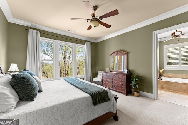 176 Stamp Mill Ln, Dahlonega, GA 30533 - carpeted bedroom with crown molding, ensuite bath, a ceiling fan, visible vents, and baseboards