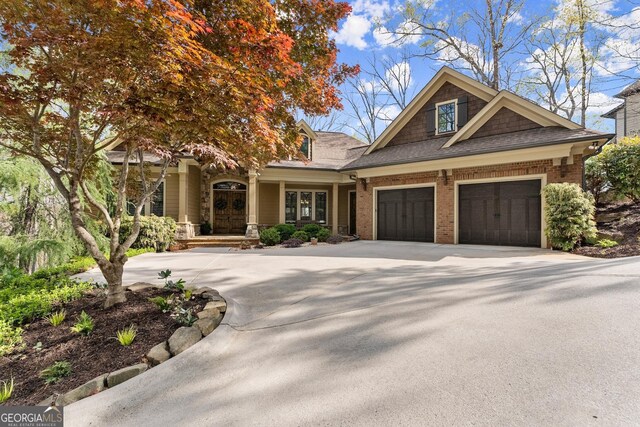 176 Stamp Mill Ln, Dahlonega, GA 30533 - view of front of house featuring a garage, a shingled roof, and concrete driveway