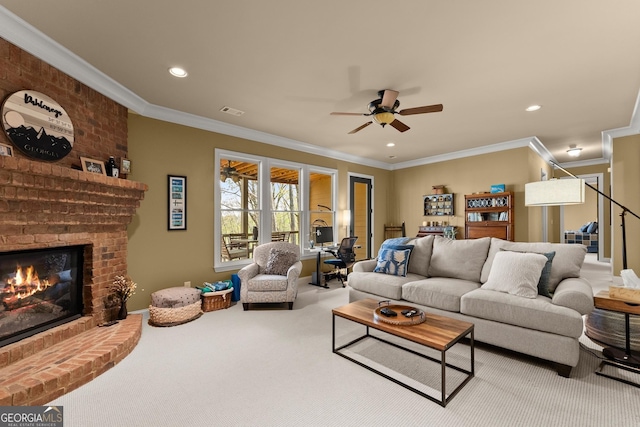 176 Stamp Mill Ln, Dahlonega, GA 30533 - living area featuring visible vents, ceiling fan, a fireplace, crown molding, and carpet floors