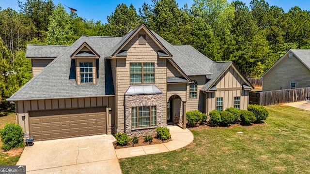 208 Jasmine Ln, Lagrange, GA 30241 - craftsman-style house with board and batten siding, a shingled roof, a front lawn, and fence