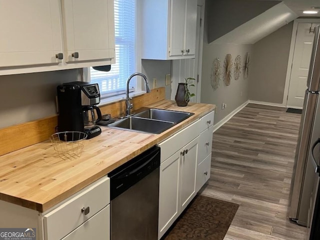 kitchen with a sink, dark wood finished floors, wooden counters, white cabinetry, and stainless steel dishwasher