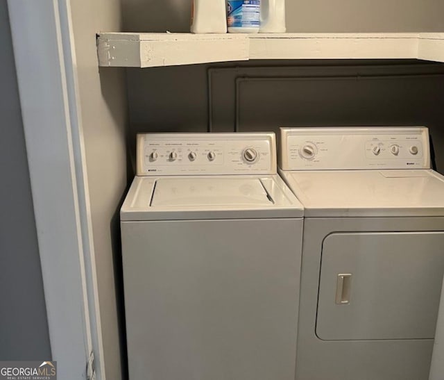washroom featuring laundry area and washer and clothes dryer