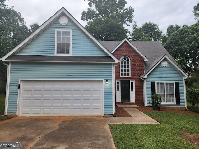traditional-style home featuring a front yard, brick siding, a garage, and driveway