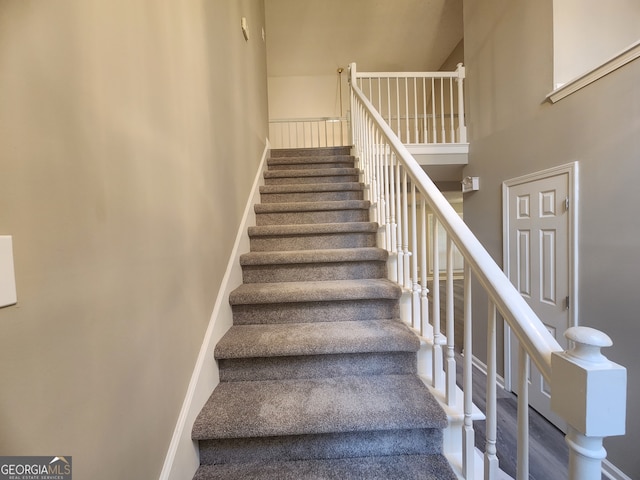 stairway with a towering ceiling