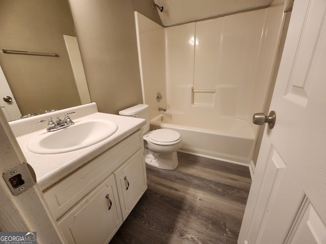 bathroom featuring toilet, shower / bath combination, wood finished floors, and vanity