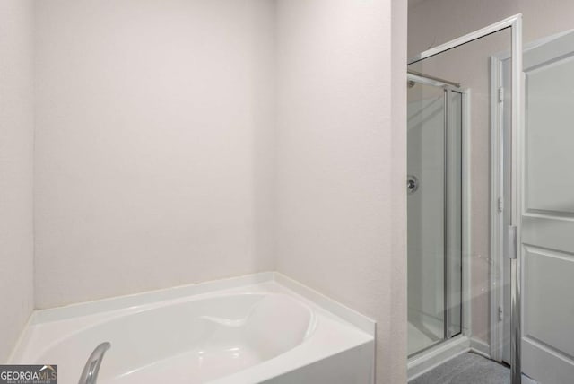 1259 Fendt Dr, Locust Grove, GA 30248 - bathroom with a shower stall and a garden tub
