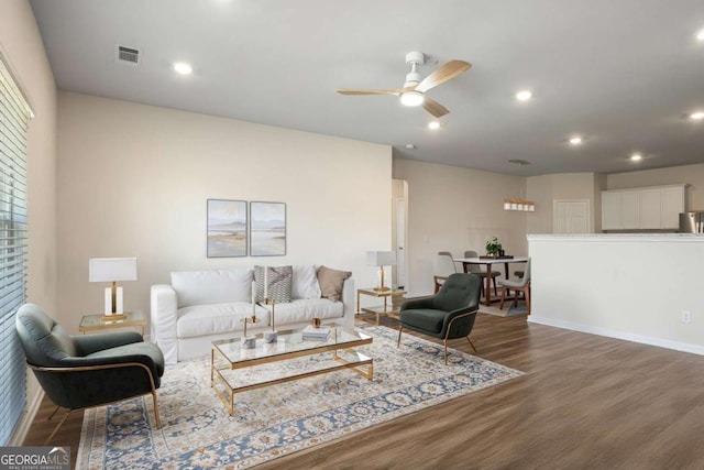 1259 Fendt Dr, Locust Grove, GA 30248 - living room featuring wood finished floors, a ceiling fan, and recessed lighting