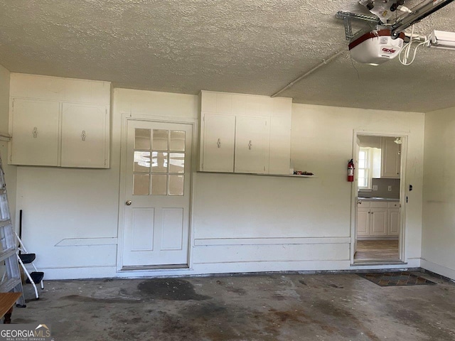 3021 Tiffin Cir, Macon, GA 31204 - garage featuring baseboards and a garage door opener