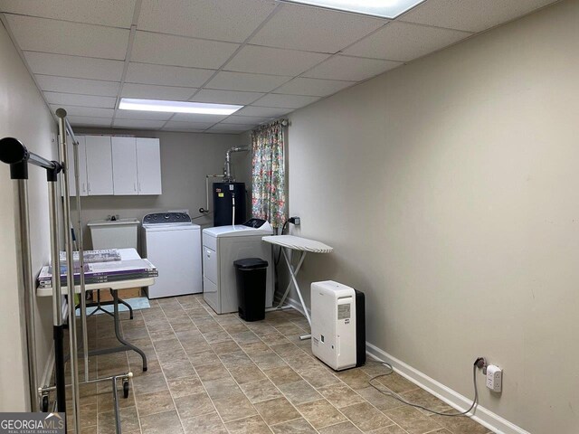 3021 Tiffin Cir, Macon, GA 31204 - laundry room featuring a sink, gas water heater, washing machine and dryer, baseboards, and cabinet space