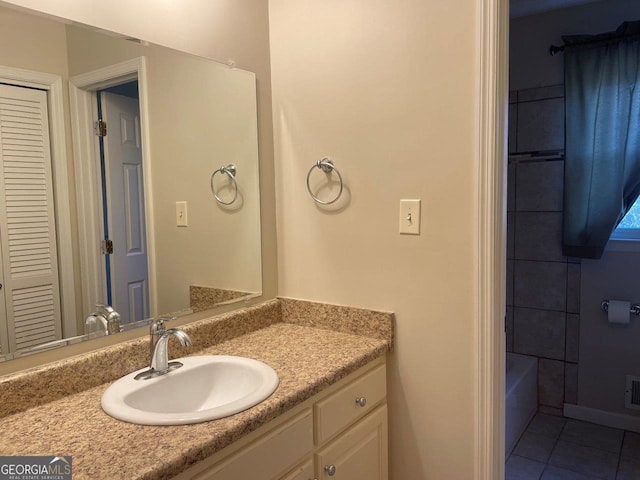 3021 Tiffin Cir, Macon, GA 31204 - full bathroom featuring tile patterned floors, visible vents, a shower, vanity, and a tub