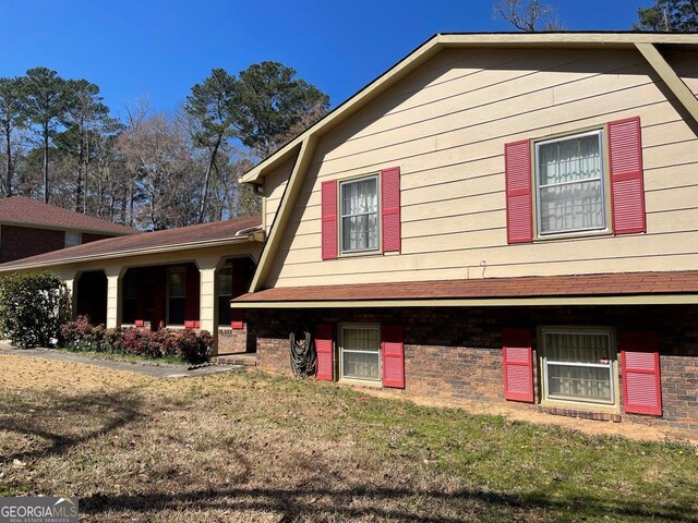 3021 Tiffin Cir, Macon, GA 31204 - view of side of property with a yard