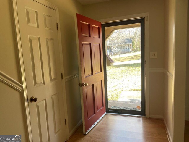 3021 Tiffin Cir, Macon, GA 31204 - doorway with baseboards and light wood-style floors