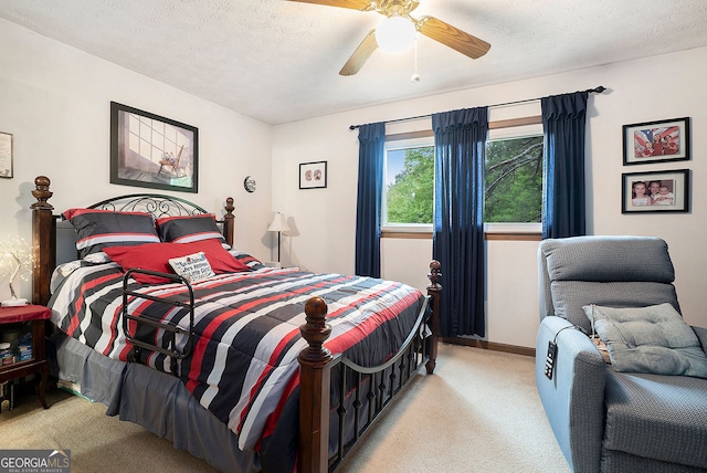 1292 Marcelle Heights Pl NW, Norcross, GA 30093 - bedroom with light colored carpet, a textured ceiling, ceiling fan, and baseboards