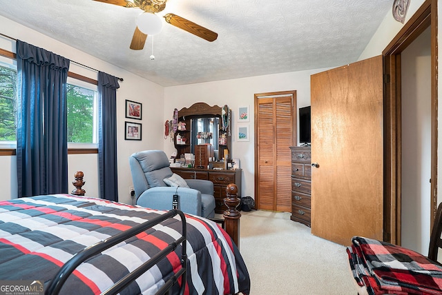 1292 Marcelle Heights Pl NW, Norcross, GA 30093 - bedroom featuring light colored carpet, a textured ceiling, a closet, and a ceiling fan