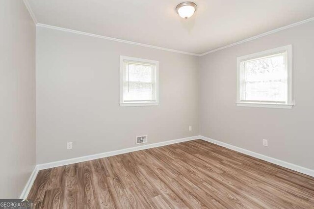 7 S Dr, Cartersville, GA 30120 - unfurnished room with crown molding, wood finished floors, and visible vents