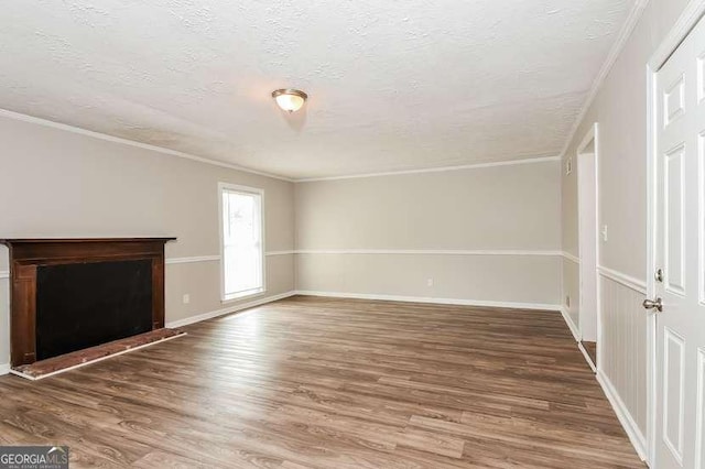 7 S Dr, Cartersville, GA 30120 - unfurnished living room with ornamental molding, baseboards, wood finished floors, and a textured ceiling
