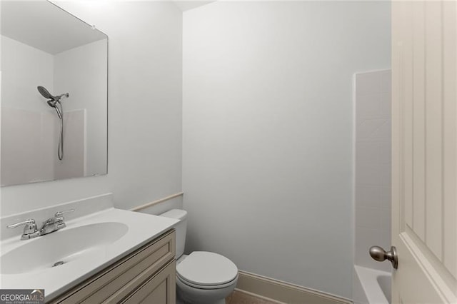 bathroom featuring toilet and vanity