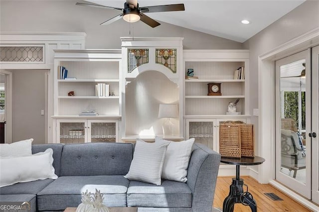 934 Pine Cir, Woodstock, GA 30189 - living area featuring wood finished floors, a ceiling fan, visible vents, and a healthy amount of sunlight