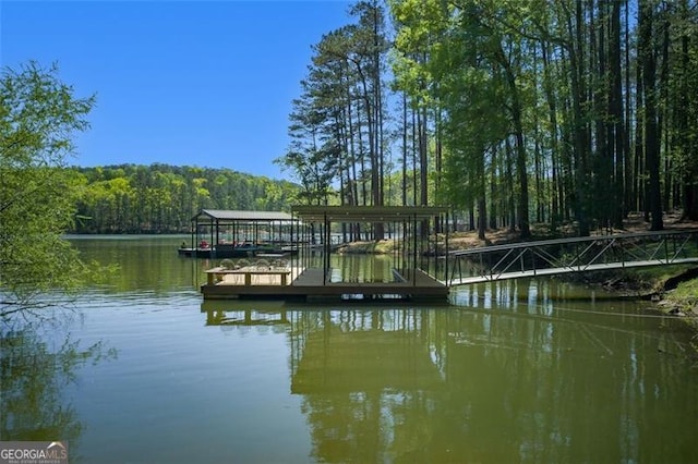 934 Pine Cir, Woodstock, GA 30189 - dock area featuring a view of trees and a water view