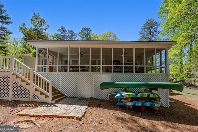 934 Pine Cir, Woodstock, GA 30189 - rear view of house featuring a ceiling fan, a sunroom, and stairs
