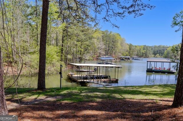 934 Pine Cir, Woodstock, GA 30189 - view of dock with a wooded view and a water view