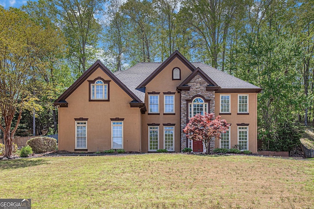 4609 Mctyre Way NW, Marietta, GA 30064 - view of front of house featuring a front lawn, stucco siding, and stone siding