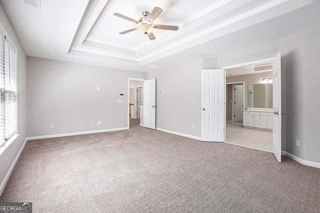 4609 Mctyre Way NW, Marietta, GA 30064 - unfurnished bedroom with a tray ceiling, multiple windows, light colored carpet, connected bathroom, and crown molding
