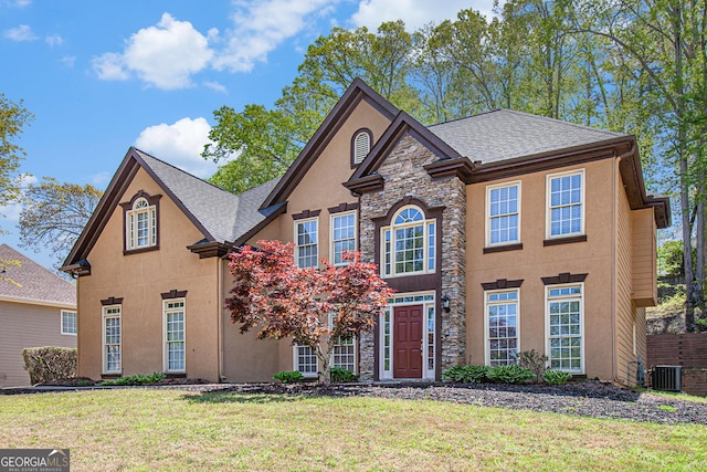 4609 Mctyre Way NW, Marietta, GA 30064 - traditional-style home featuring stone siding, stucco siding, a front lawn, and a shingled roof