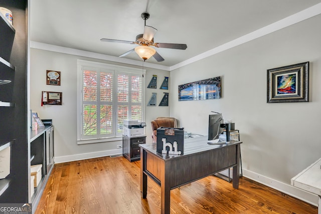 home office with baseboards, a ceiling fan, and wood finished floors