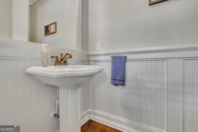 bathroom featuring wainscoting and wood finished floors