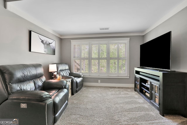 living area with carpet flooring, baseboards, and visible vents