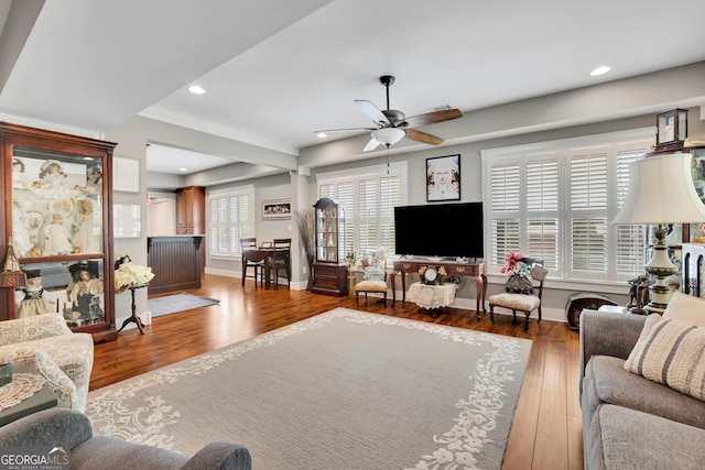 living room with baseboards, recessed lighting, ceiling fan, and wood finished floors