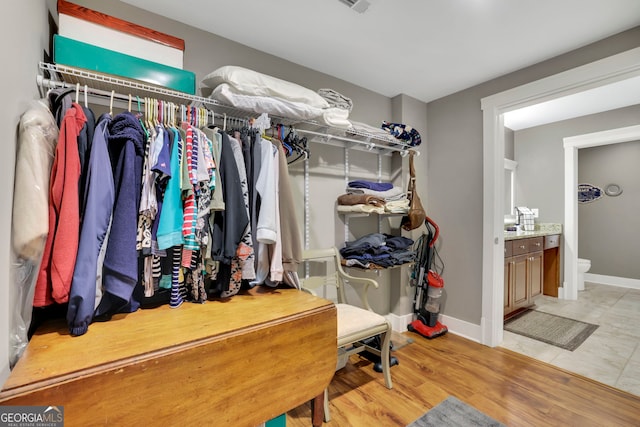 spacious closet with light wood finished floors