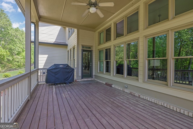 deck featuring grilling area and ceiling fan