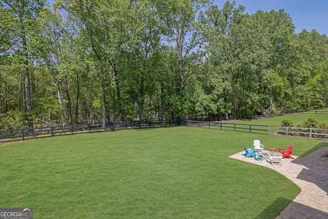 view of yard featuring fence private yard and a patio area