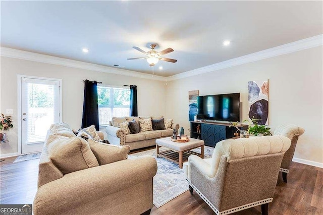 2316 Hastings Manor Ln, Hampton, GA 30228 - living area featuring dark wood-type flooring, ceiling fan, baseboards, and crown molding