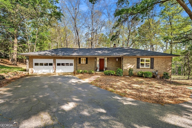2209 Ridge Rd, Hartwell, GA 30643 - ranch-style home featuring driveway, an attached garage, and brick siding