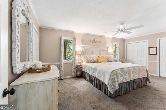 2209 Ridge Rd, Hartwell, GA 30643 - carpeted bedroom featuring crown molding, multiple windows, multiple closets, a ceiling fan, and a textured ceiling