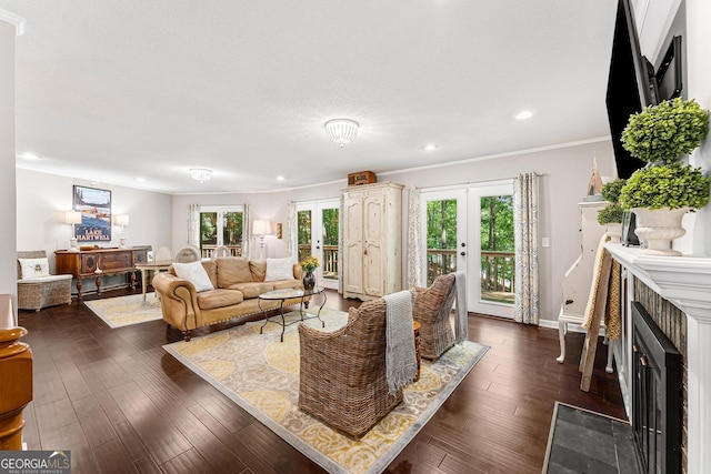 living room with ornamental molding, recessed lighting, a fireplace with flush hearth, and dark wood-style floors