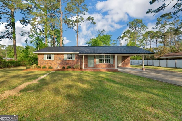 930 Burney Branch Cir, Blackshear, GA 31516 - single story home with concrete driveway, a front yard, fence, and an attached carport