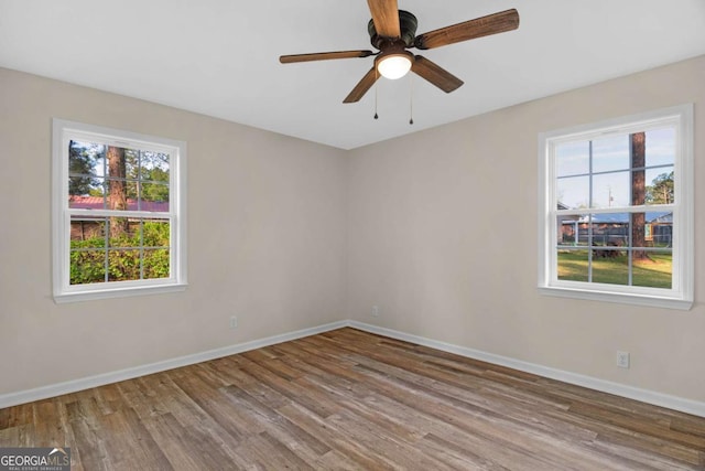 930 Burney Branch Cir, Blackshear, GA 31516 - unfurnished room with baseboards, a ceiling fan, and wood finished floors
