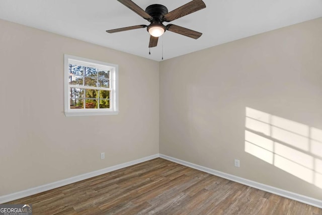 930 Burney Branch Cir, Blackshear, GA 31516 - empty room featuring wood finished floors, ceiling fan, and baseboards