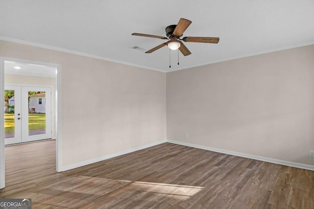 930 Burney Branch Cir, Blackshear, GA 31516 - empty room with french doors, baseboards, visible vents, and wood finished floors