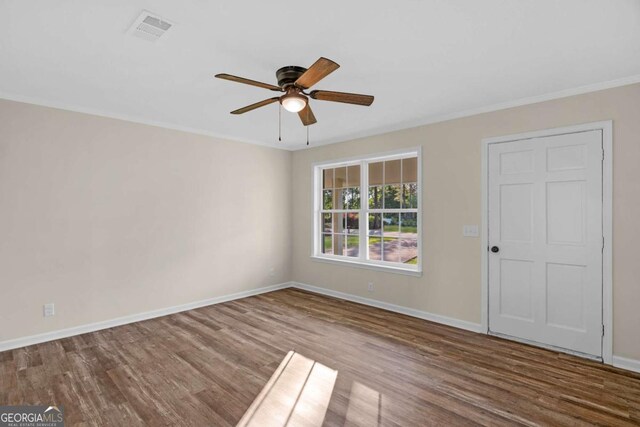 930 Burney Branch Cir, Blackshear, GA 31516 - spare room with visible vents, ceiling fan, wood finished floors, and baseboards